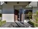 A modern home entrance featuring a sleek door, clean lines, and manicured landscaping at 8925 W Flamingo Rd # 117, Las Vegas, NV 89147