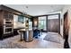 Chic kitchen with built-in oven, stainless steel appliances, island seating, and sleek design elements at 8925 W Flamingo Rd # 117, Las Vegas, NV 89147