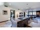 Open floor plan showcasing the kitchen with a center island, stainless steel appliances, and living area at 8925 W Flamingo Rd # 117, Las Vegas, NV 89147