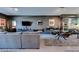 Elegant living space featuring a large sectional sofa, modern decor, and sleek entertainment unit at 8925 W Flamingo Rd # 117, Las Vegas, NV 89147