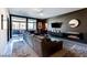 Spacious living area with modern decor, large windows, and comfortable seating arrangements at 8925 W Flamingo Rd # 117, Las Vegas, NV 89147