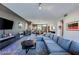 Comfortable living area showcasing a large sectional sofa, stylish decor, and ample space at 8925 W Flamingo Rd # 117, Las Vegas, NV 89147
