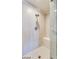 Modern tiled shower with a built-in seat and glass door at 8925 W Flamingo Rd # 117, Las Vegas, NV 89147