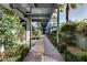 A covered walkway with lush greenery leads through this well-maintained community at 8925 W Flamingo Rd # 117, Las Vegas, NV 89147