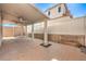 Wide shot of back patio featuring desert landscaping and a covered structure with a ceiling fan at 9073 Spoonbill Ridge Pl, Las Vegas, NV 89143