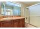 Bathroom with a shower/tub combo, tile surround, and a vanity with a sink at 9073 Spoonbill Ridge Pl, Las Vegas, NV 89143