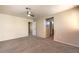 Carpeted bedroom with neutral walls, ceiling fan and view to bathroom at 9073 Spoonbill Ridge Pl, Las Vegas, NV 89143