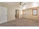 Bright bedroom with neutral walls, ceiling fan, shuttered windows and carpeted floors at 9073 Spoonbill Ridge Pl, Las Vegas, NV 89143