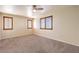 Bedroom with neutral walls, carpeted flooring, a ceiling fan, and shuttered windows at 9073 Spoonbill Ridge Pl, Las Vegas, NV 89143