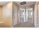 Upstairs hallway with neutral walls, carpet flooring, and doors leading to bedrooms at 9073 Spoonbill Ridge Pl, Las Vegas, NV 89143