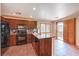 Updated kitchen with stainless steel appliances and granite countertops, featuring a breakfast bar at 9073 Spoonbill Ridge Pl, Las Vegas, NV 89143