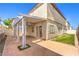 Cozy covered patio with well manicured lawn, offering great outdoor entertaining space at 9073 Spoonbill Ridge Pl, Las Vegas, NV 89143