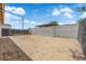 Expansive backyard featuring a dirt landscape and a block fence, creating a private outdoor space at 952 Balzar Ave, Las Vegas, NV 89106