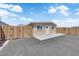 Exterior of the backyard house featuring a private yard with a wood fence and paved driveway at 952 Balzar Ave, Las Vegas, NV 89106