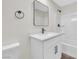 Modern bathroom featuring a white vanity with square mirror and tub-shower combination at 952 Balzar Ave, Las Vegas, NV 89106