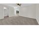 Spacious bedroom with carpet flooring, ceiling fan, and sliding door access to the backyard at 952 Balzar Ave, Las Vegas, NV 89106
