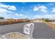 Property showcasing a mailbox, ample parking, and partially fenced perimeter, complemented by a serene blue sky at 952 Balzar Ave, Las Vegas, NV 89106