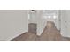 Hallway showcasing the transition from wood flooring to carpeted bedroom at 952 Balzar Ave, Las Vegas, NV 89106