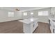 Modern kitchen featuring a quartz island, stainless steel appliances, and sleek white cabinetry at 952 Balzar Ave, Las Vegas, NV 89106