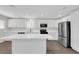 Modern kitchen featuring stainless steel appliances, an island, and sleek white cabinetry at 952 Balzar Ave, Las Vegas, NV 89106