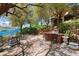 Expansive backyard features lush greenery, a built-in outdoor kitchen, and a stunning lake view at 1 Via Mira Monte, Henderson, NV 89011