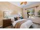 Bright bedroom with a comfortable bed, decorative pillows, and large window with a view of palm trees at 1 Via Mira Monte, Henderson, NV 89011