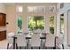 Elegant dining room with modern decor, large windows, and plenty of natural light at 1 Via Mira Monte, Henderson, NV 89011