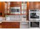 Kitchen with stainless steel appliances, granite countertops, and custom cabinetry at 1 Via Mira Monte, Henderson, NV 89011