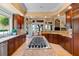 Spacious kitchen with a large island, stainless steel appliances, and views of the lush backyard at 1 Via Mira Monte, Henderson, NV 89011