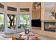 Bright and airy living room with a fireplace, views to the outdoors, and comfortable seating at 1 Via Mira Monte, Henderson, NV 89011