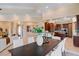 Open-concept living area with soaring ceilings, elegant columns, and bright white furnishings at 1 Via Mira Monte, Henderson, NV 89011