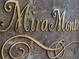 Close up of the 'Mira Monte' gilded marble property signage at 1 Via Mira Monte, Henderson, NV 89011