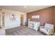 Bright Bedroom with cozy rocking chair and whimsical decor for a calming ambiance at 1011 Gentle Swan St # Lot 697, Henderson, NV 89011