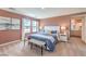 A serene bedroom with natural light, plush bedding, and a glimpse into the attached bathroom at 1011 Gentle Swan St # Lot 697, Henderson, NV 89011