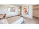 Bright bedroom with cozy bed, fun wall art, and a closet for ample storage at 1011 Gentle Swan St # Lot 697, Henderson, NV 89011