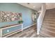 Hallway with stylish decor leading to a staircase, featuring modern accents and finishes at 1011 Gentle Swan St # Lot 697, Henderson, NV 89011