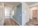 Inviting entryway featuring wood floors and a round decorative mirror at 1011 Gentle Swan St # Lot 697, Henderson, NV 89011