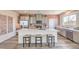 A well-lit kitchen showcasing a spacious center island with seating and stainless appliances at 1011 Gentle Swan St # Lot 697, Henderson, NV 89011