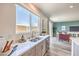 Well-lit kitchen with stainless steel appliances and a view into a stylishly decorated living area at 1011 Gentle Swan St # Lot 697, Henderson, NV 89011