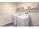 Well-equipped laundry room with a washer and dryer, plus ample shelf space at 1011 Gentle Swan St # Lot 697, Henderson, NV 89011