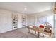 Bright office space with stylish shelving, natural light, and a cozy desk setup at 1011 Gentle Swan St # Lot 697, Henderson, NV 89011