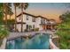 Exterior of home featuring a patio, pool, and landscaped backyard at 10301 Orkiney Dr, Las Vegas, NV 89144