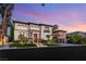 Stunning two-story home featuring manicured landscaping and a stone facade at 10301 Orkiney Dr, Las Vegas, NV 89144