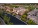 Beautiful two-story home showcases a tile roof, an attached two-car garage, and manicured landscaping on a quiet street at 10301 Orkiney Dr, Las Vegas, NV 89144