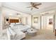 Bright main bedroom featuring a seating area and decorative mirrors at 10301 Orkiney Dr, Las Vegas, NV 89144