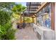 Well-appointed outdoor kitchen featuring a built-in grill, pizza oven, and stylish counter, perfect for entertaining at 10301 Orkiney Dr, Las Vegas, NV 89144