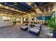 Expansive covered patio with comfortable seating and seamless indoor-outdoor flow at 10301 Orkiney Dr, Las Vegas, NV 89144