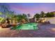 Serene backyard pool area with lush landscaping and a tranquil Buddha statue at 10301 Orkiney Dr, Las Vegas, NV 89144