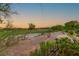 Desert backyard with a view of the community golf course at 10301 Orkiney Dr, Las Vegas, NV 89144