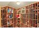 Spacious wine cellar with wooden racks for storing wine bottles and climate control at 10301 Orkiney Dr, Las Vegas, NV 89144